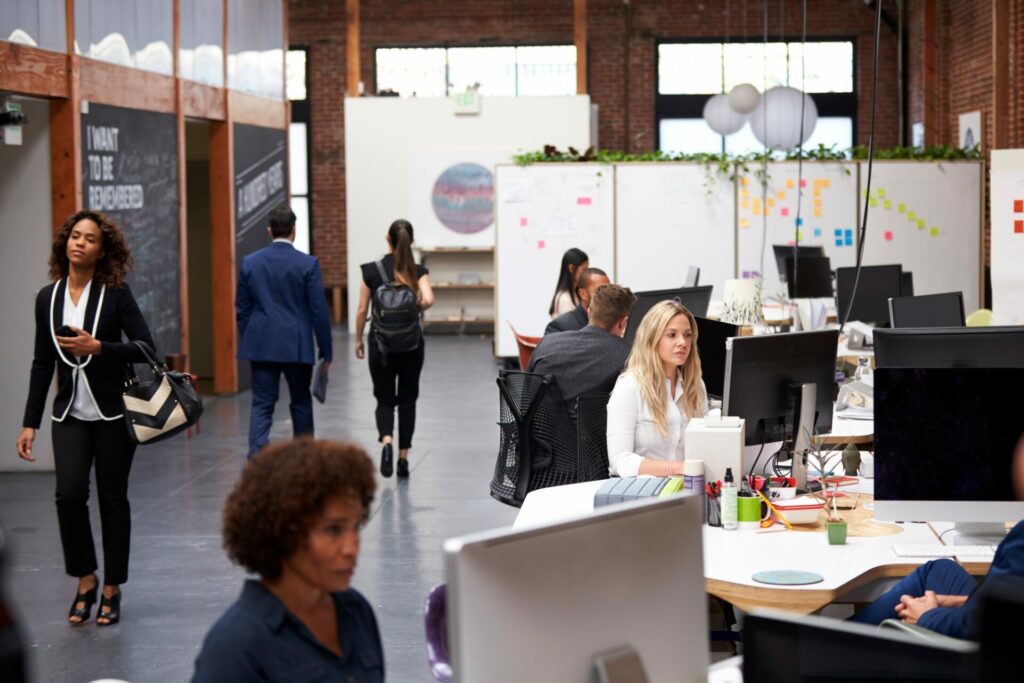 Business team working at desks in modern open plan office